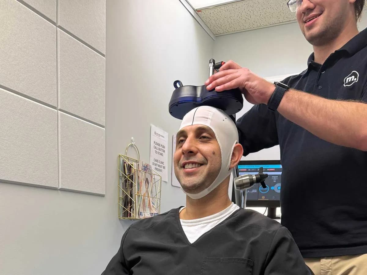 Resova Health staff preparing a patient for TMS at the Fairfax office