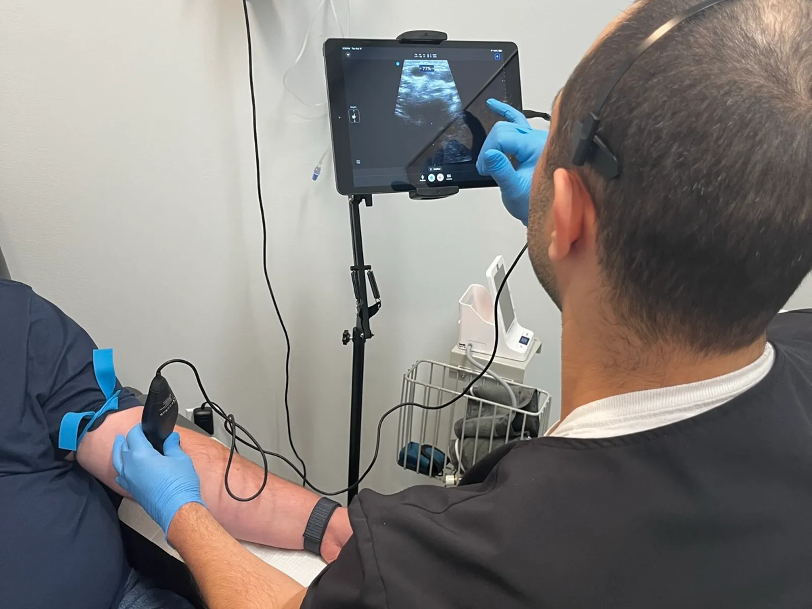 Resova Health staff placing an IV with ultrasound guidance before a ketamine infusion at the Fairfax office