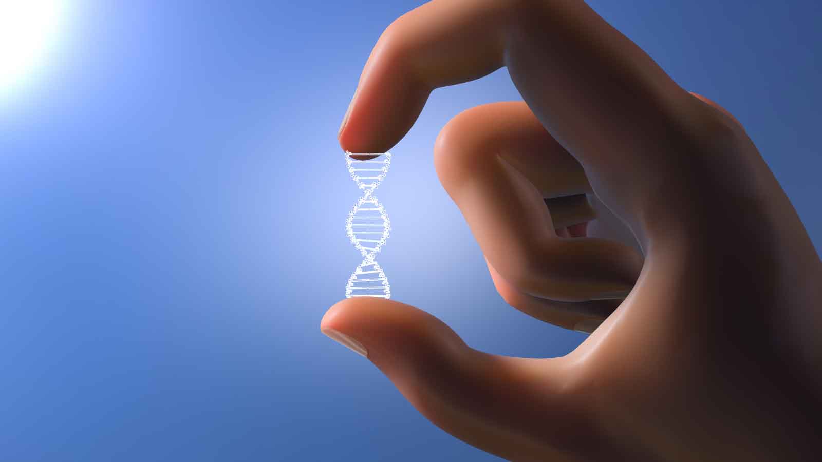 A hand holding a glowing DNA strand against a clear sky