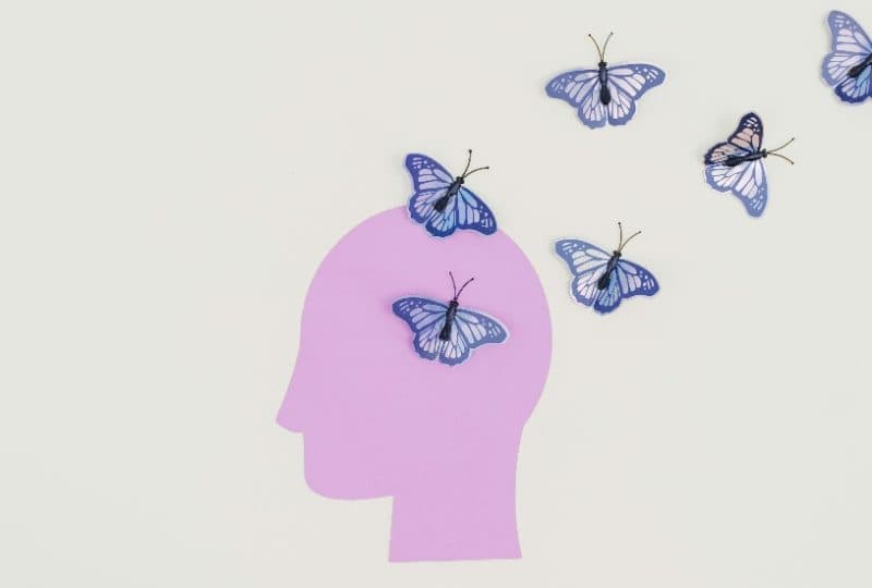 head and blue butterflies