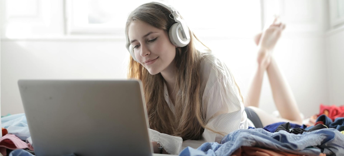 A woman listening to a podcast