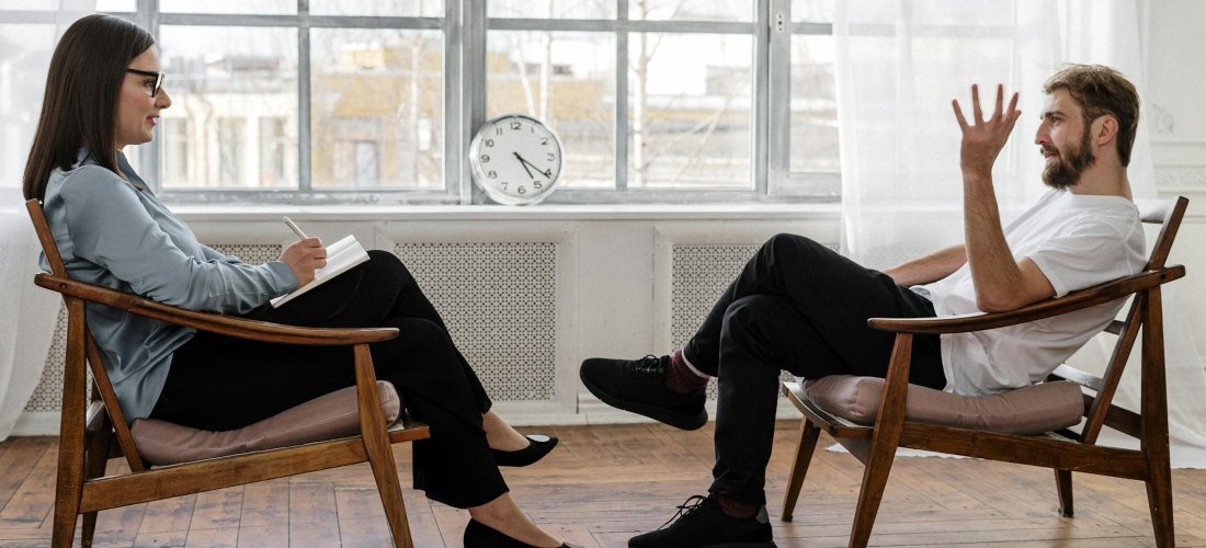 Man talking to his therapist about dopamine and addiction