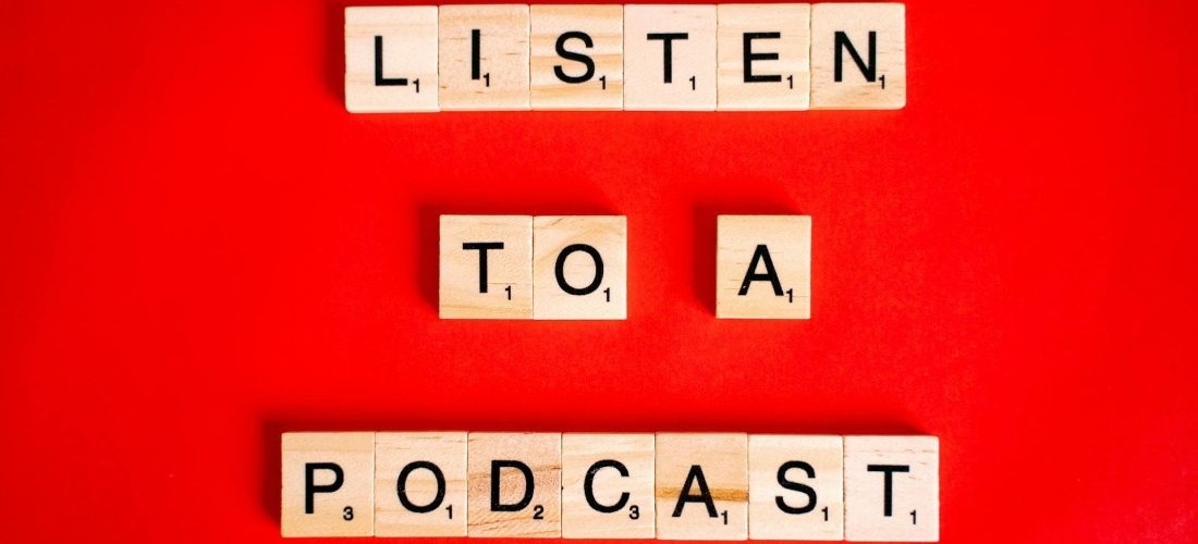 Scrabble letters spelled Listen to a podcast