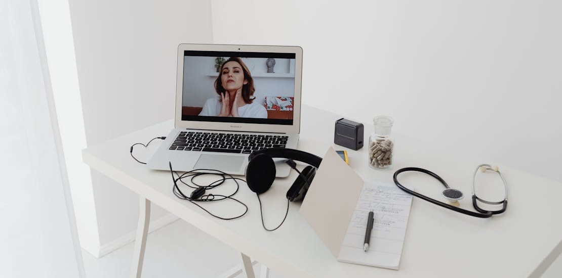 A professional explaining online medication assisted treatment.