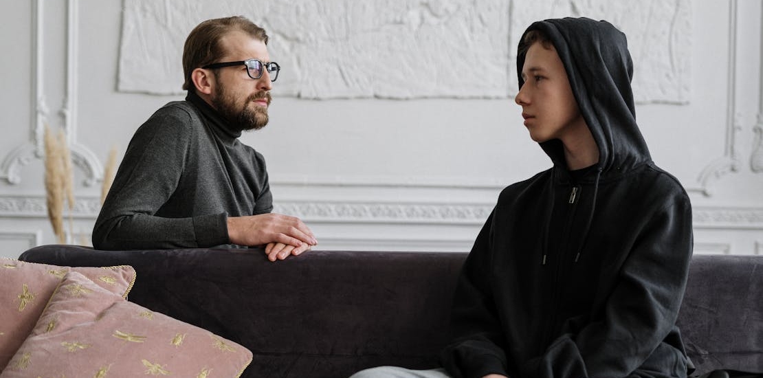 a teen talking with a therapist