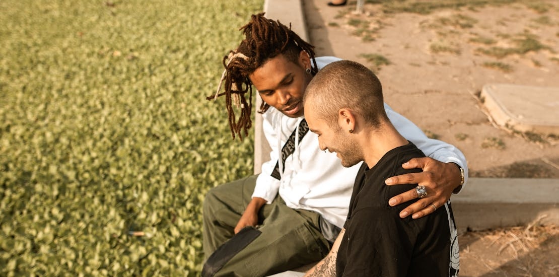 a man helping a friend get out of a bipolar depressive episode