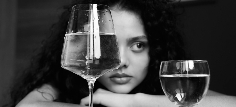 Woman looking through a glass.