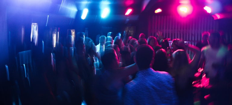 A blurred nightclub scene.