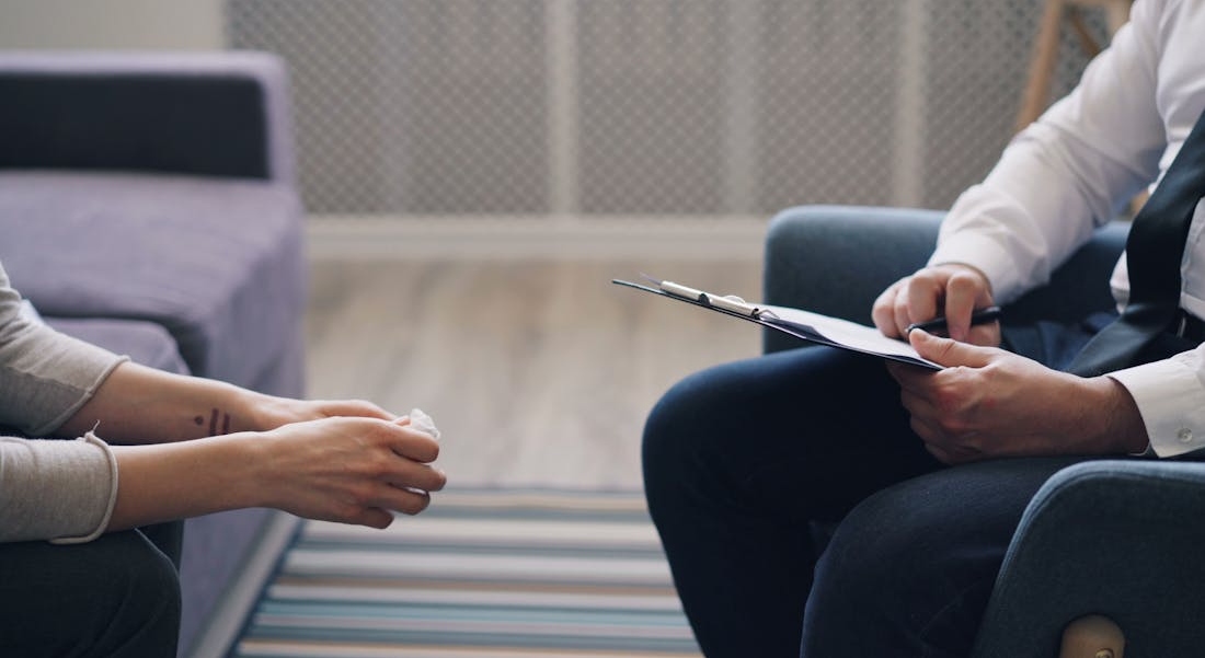 Therapist talking to a patient about addiction and mental health treatment in Florida.