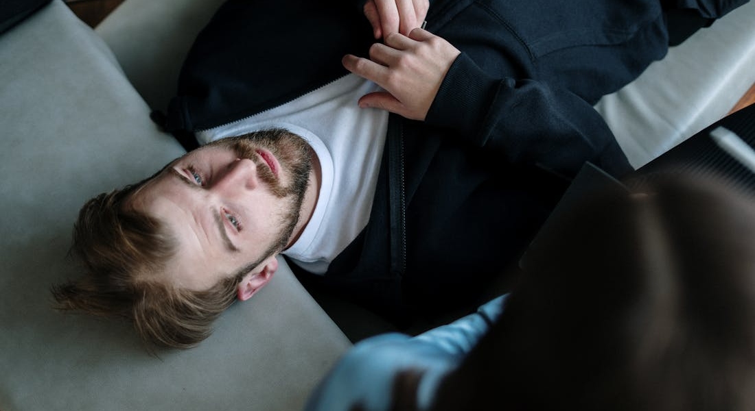 a man lying on the couch wondering about Addiction and Mental Health Treatment in Washington